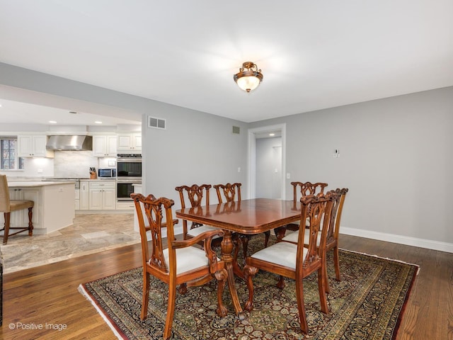 dining room with hardwood / wood-style floors