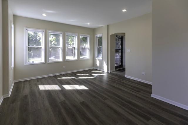 empty room featuring dark wood-type flooring