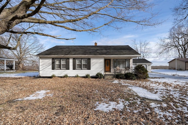 ranch-style home featuring a garage and a porch