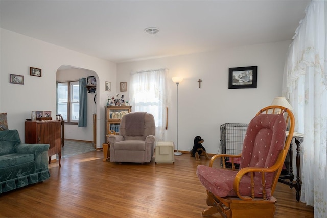 sitting room with hardwood / wood-style flooring