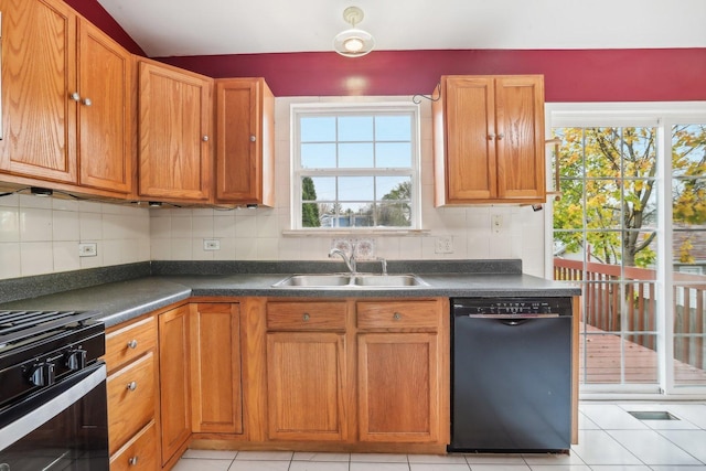 kitchen featuring black appliances, decorative backsplash, light tile patterned flooring, and sink