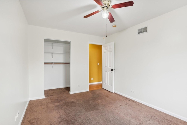 unfurnished bedroom featuring a closet, ceiling fan, and carpet floors