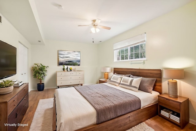 bedroom featuring ceiling fan and light hardwood / wood-style floors