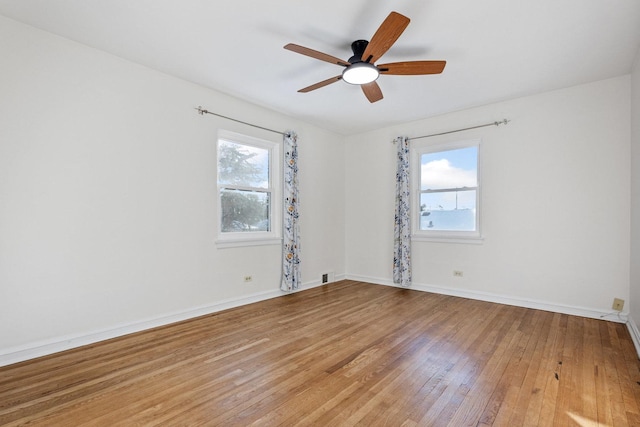 spare room with ceiling fan and hardwood / wood-style floors