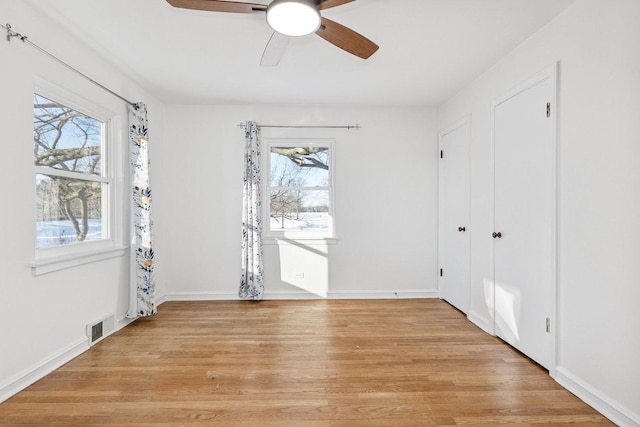 interior space with ceiling fan and light hardwood / wood-style floors