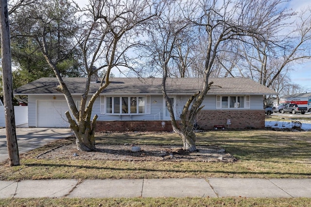 ranch-style house with a front yard and a garage