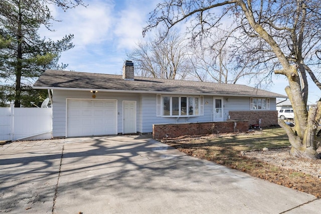 ranch-style home featuring a garage