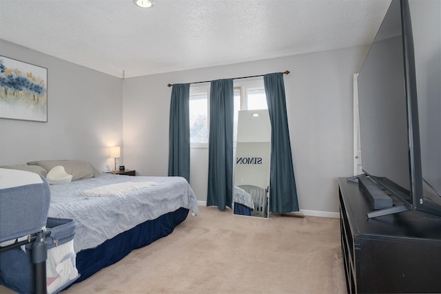 carpeted bedroom featuring a textured ceiling