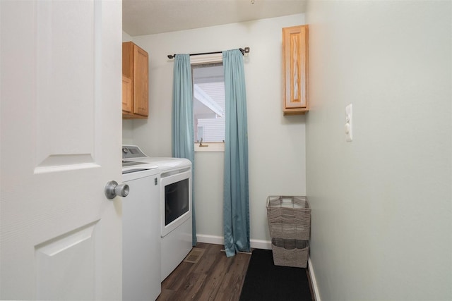 laundry room featuring separate washer and dryer, cabinets, and dark hardwood / wood-style flooring