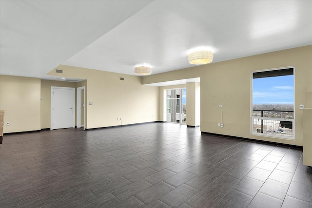 301 N Neil St Unit 808-809, Champaign, IL 61820 - unfurnished living room featuring plenty of natural light and baseboards