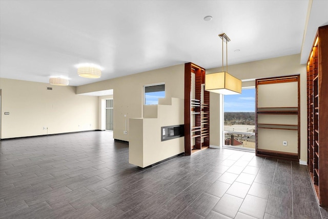 301 N Neil St Unit 808-809, Champaign, IL 61820 - unfurnished room with baseboards and wood tiled floors