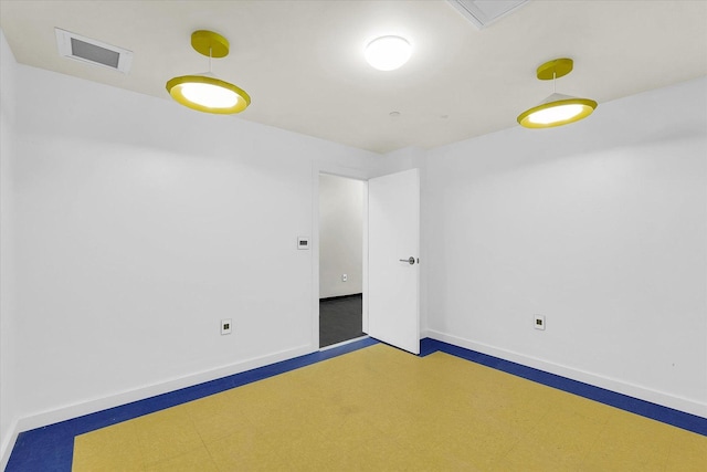 301 N Neil St Unit 808-809, Champaign, IL 61820 - spare room with baseboards and tile patterned floors