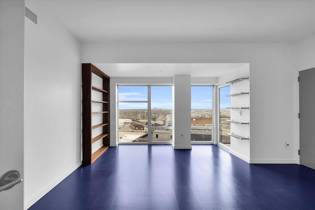301 N Neil St Unit 808-809, Champaign, IL 61820 - spare room with baseboards and plenty of natural light