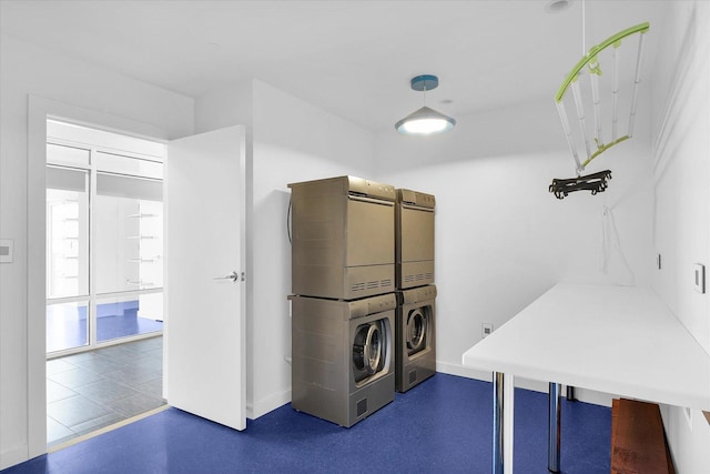 laundry area with stacked washer / dryer