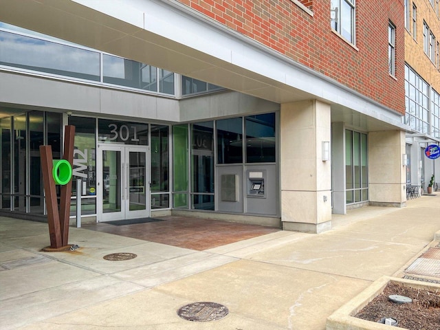 301 N Neil St Unit 808-809, Champaign, IL 61820 - doorway to property with french doors and brick siding