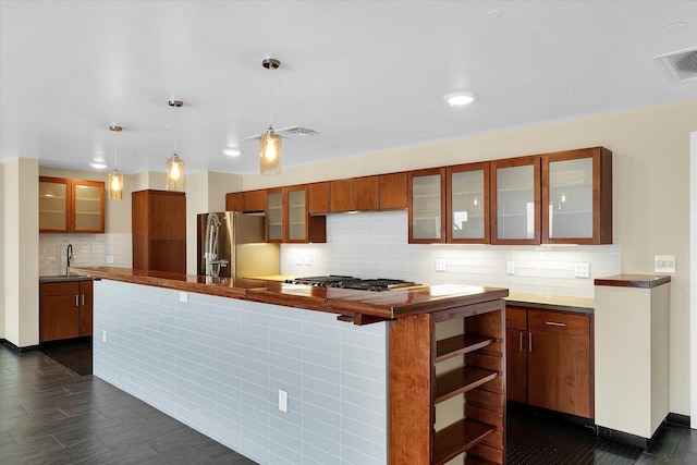 301 N Neil St Unit 808-809, Champaign, IL 61820 - kitchen with freestanding refrigerator, tasteful backsplash, gas stovetop, dark wood-type flooring, and glass insert cabinets