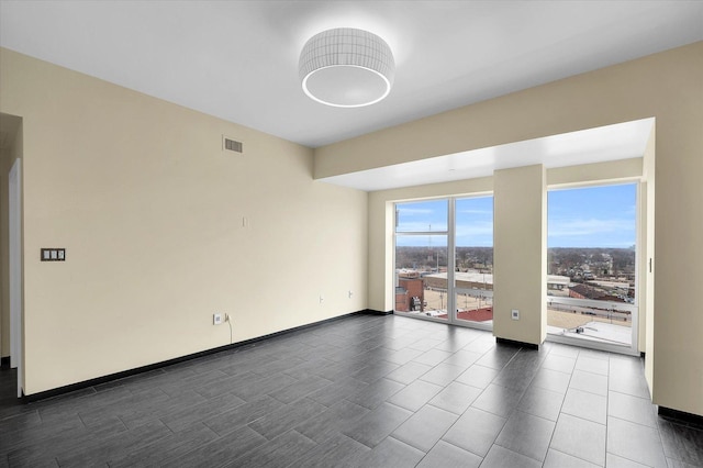 301 N Neil St Unit 808-809, Champaign, IL 61820 - empty room featuring baseboards