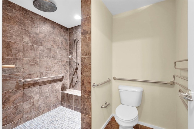 301 N Neil St Unit 808-809, Champaign, IL 61820 - bathroom with a tile shower, toilet, and baseboards