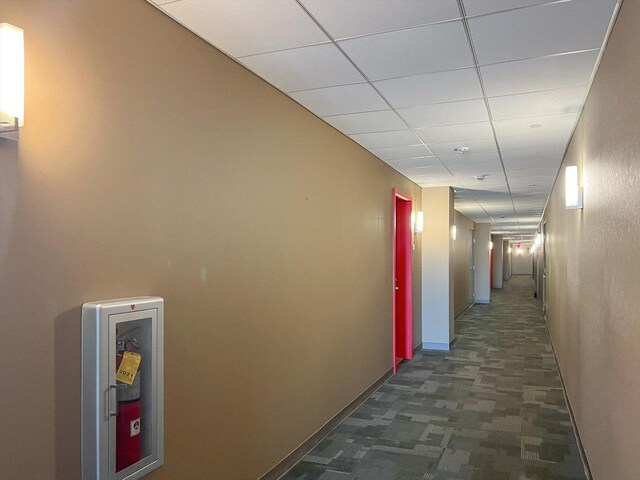 301 N Neil St Unit 808-809, Champaign, IL 61820 - hall with baseboards and a paneled ceiling