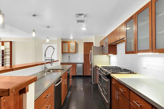 301 N Neil St Unit 808-809, Champaign, IL 61820 - kitchen with a sink, appliances with stainless steel finishes, backsplash, pendant lighting, and glass insert cabinets