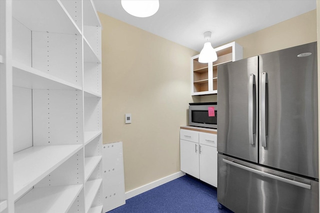 301 N Neil St Unit 808-809, Champaign, IL 61820 - kitchen with stainless steel appliances, open shelves, white cabinets, baseboards, and light countertops