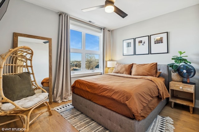 bedroom featuring ceiling fan and light hardwood / wood-style flooring