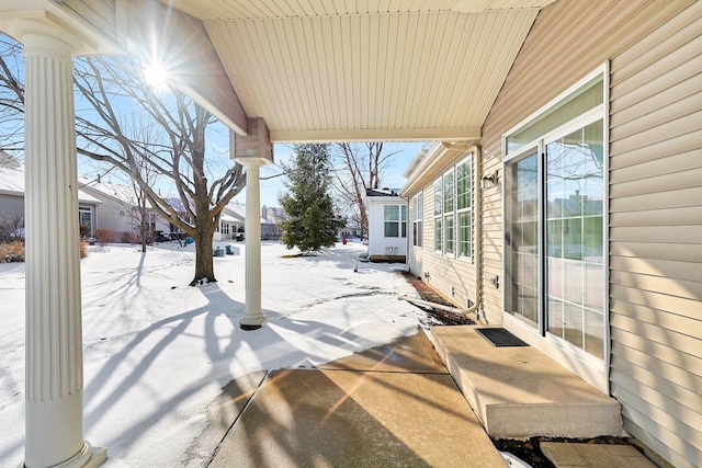 view of snow covered patio