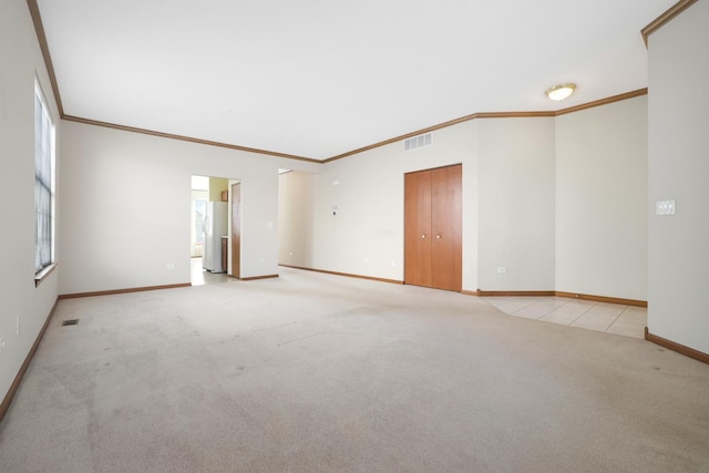 carpeted empty room featuring ornamental molding