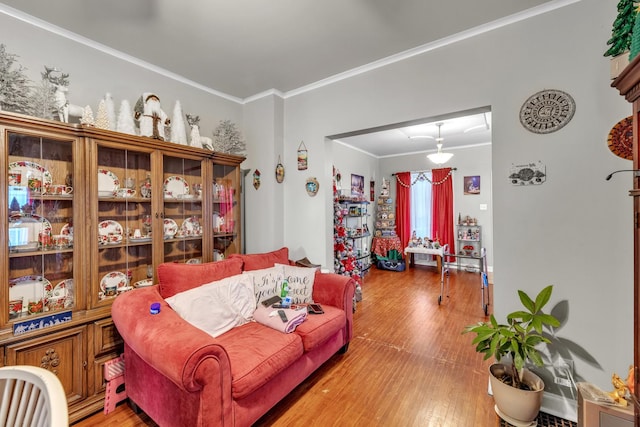 living room featuring crown molding and wood-type flooring