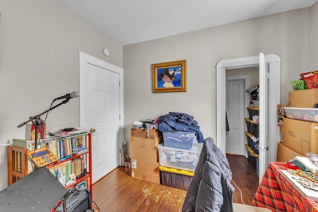 bedroom with dark wood-type flooring