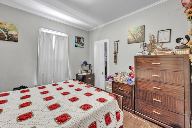 bedroom featuring light hardwood / wood-style floors and ornamental molding