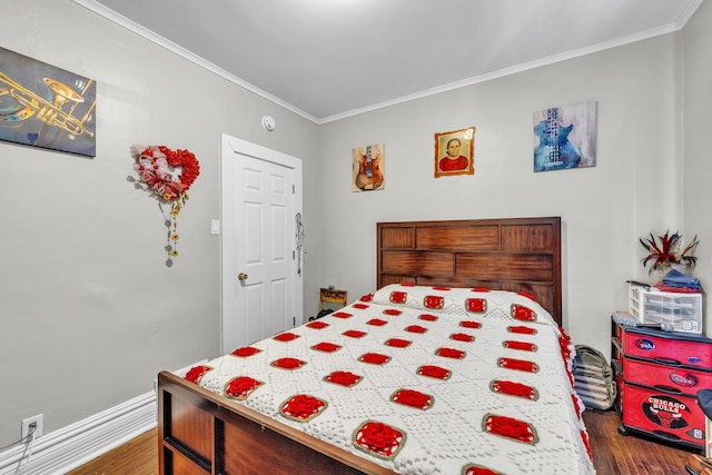 bedroom with dark wood-type flooring and crown molding