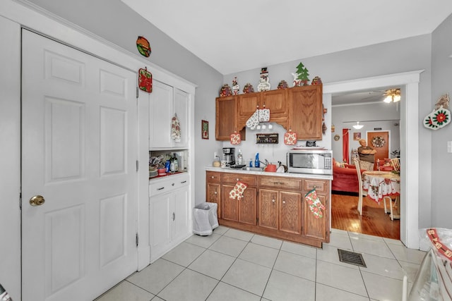 kitchen featuring ceiling fan and light tile patterned floors