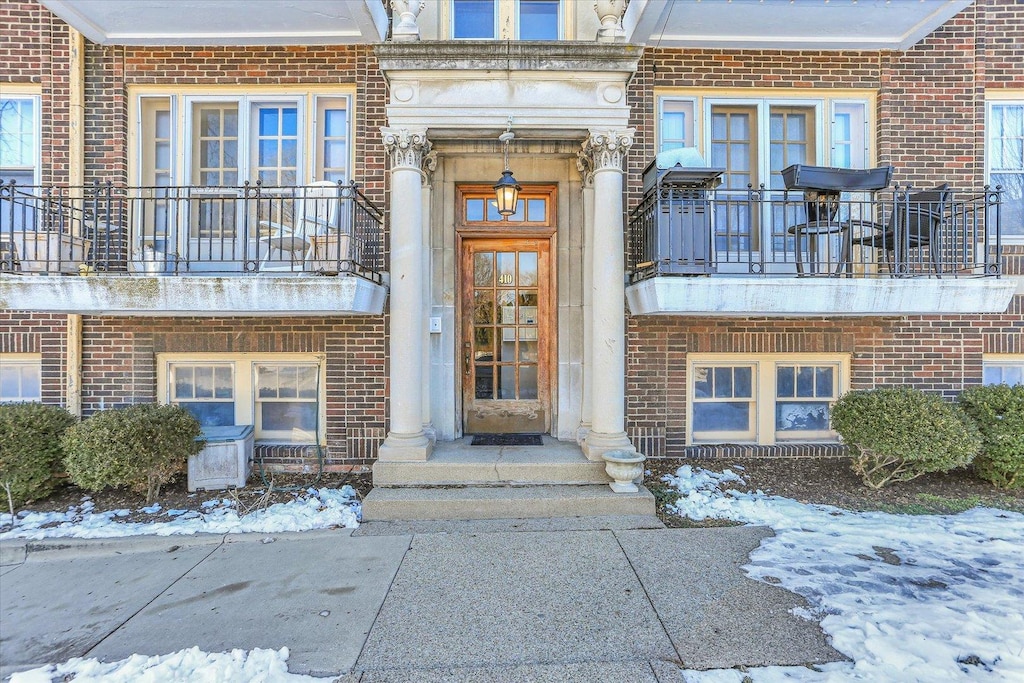 view of snow covered property entrance