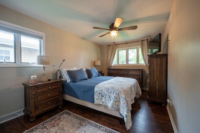 bedroom with ceiling fan and dark hardwood / wood-style flooring