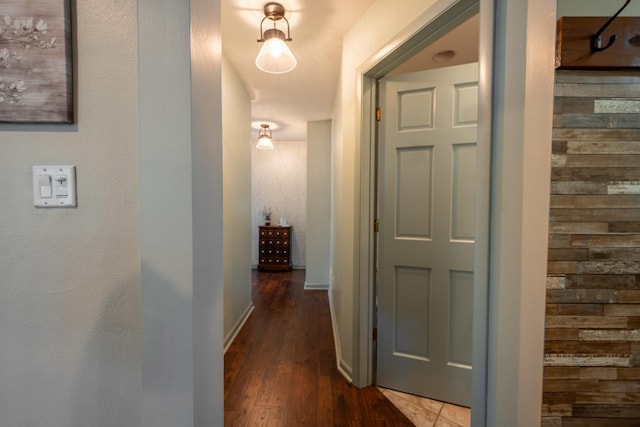 corridor featuring dark hardwood / wood-style floors