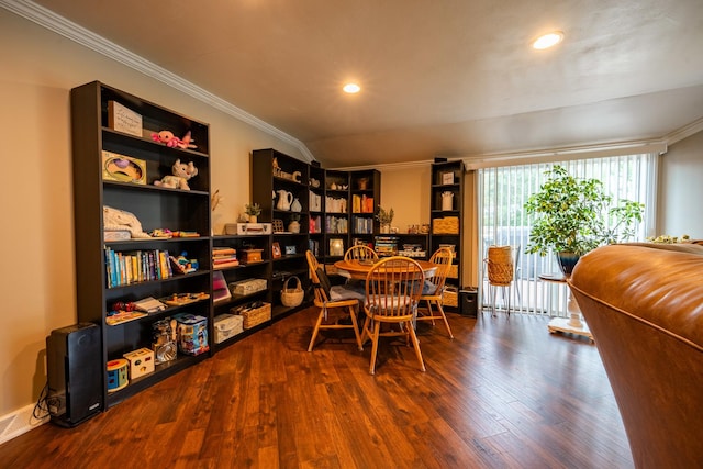 dining space with hardwood / wood-style flooring and crown molding