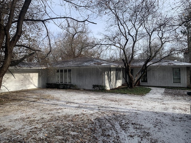 view of property exterior with a garage