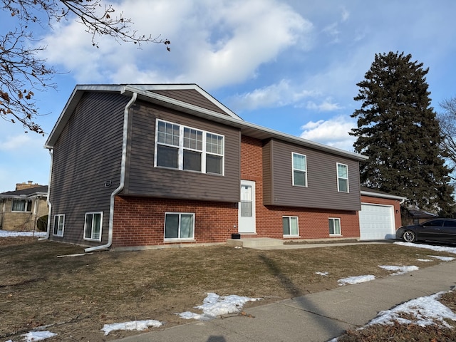 view of front facade with a front yard and a garage