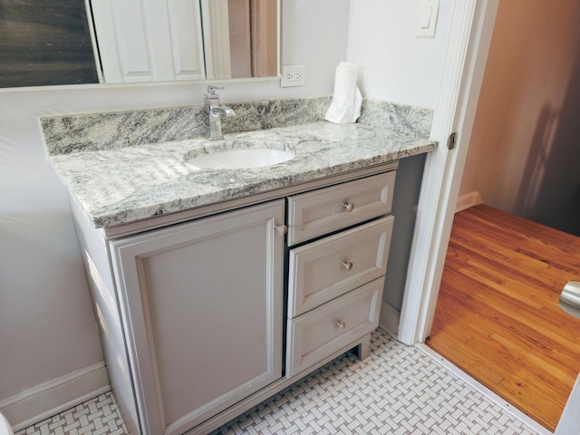 bathroom with vanity and tile patterned floors