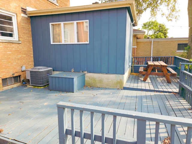 wooden deck featuring central AC unit