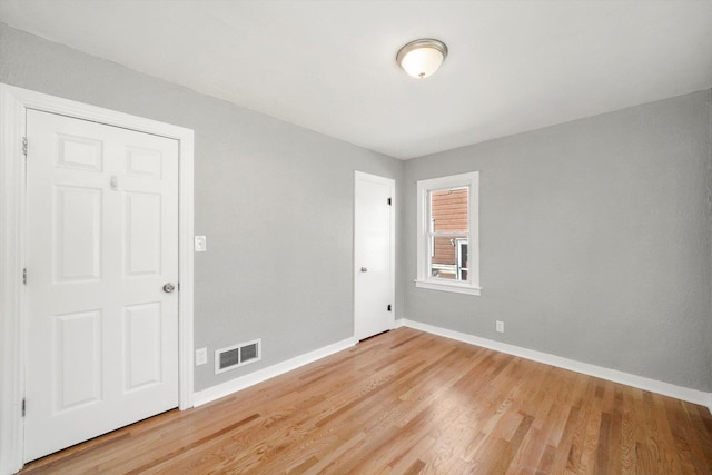 spare room featuring hardwood / wood-style floors