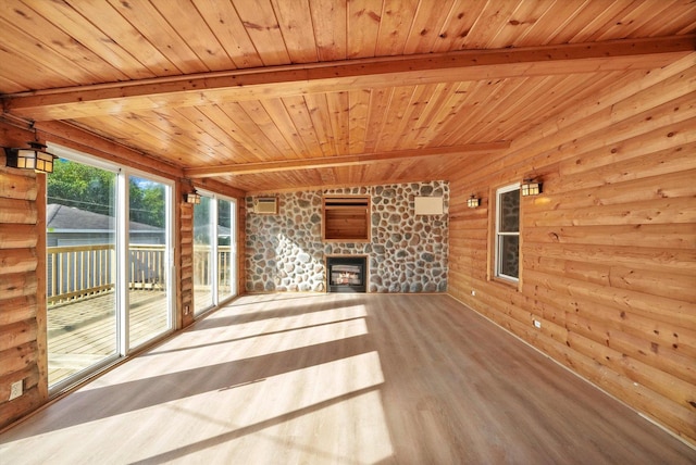 unfurnished living room featuring beamed ceiling, a fireplace, log walls, and wood ceiling