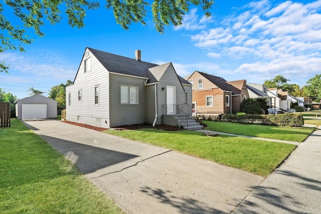 bungalow-style house featuring a front lawn, a garage, and an outdoor structure