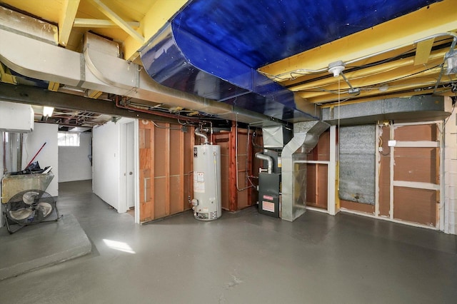 basement featuring heating unit and water heater