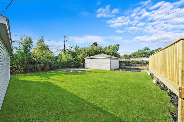 view of yard with an outbuilding and a garage