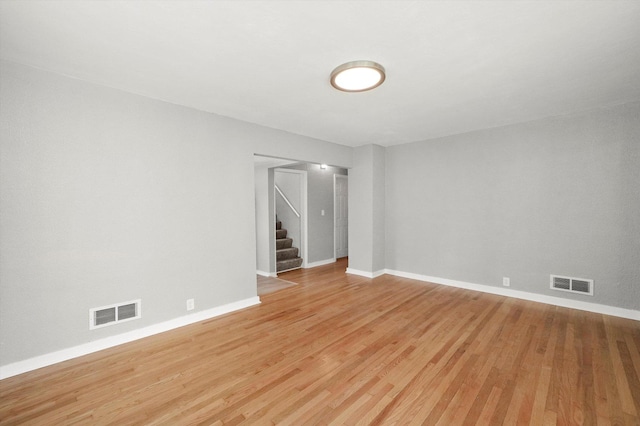 unfurnished room with light wood-type flooring