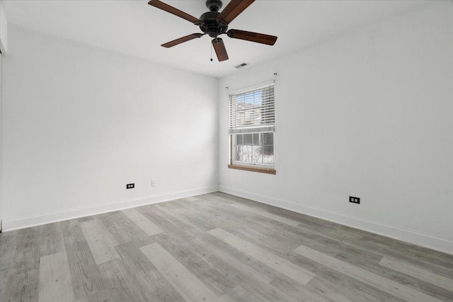 unfurnished room with ceiling fan and light wood-type flooring