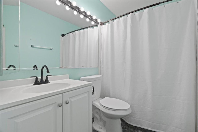 bathroom featuring vanity and toilet