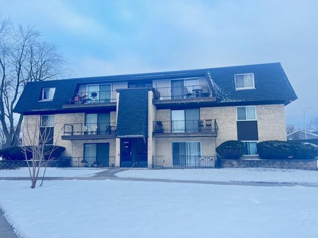 view of snow covered property